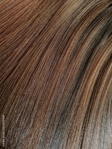 A palette of shades of dyes for brunette hair in a beauty salon.