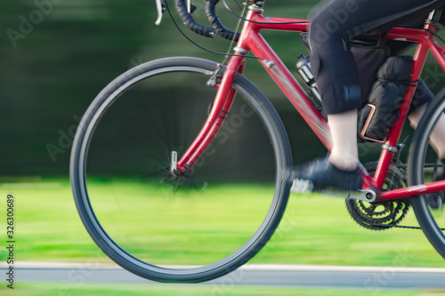 Riding bicycle - blurred motion, fast driving.