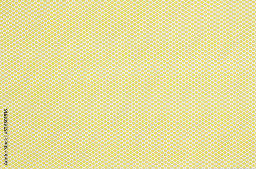 creative hole net grate on yellow background creative hole net grate on yellow background