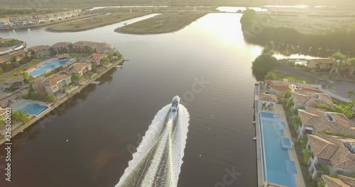 Drone view of a yacht in the Hiterote canals, Venezuela, during the golden hour photo