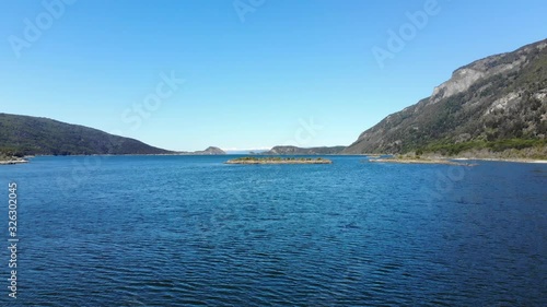 Flying low above water in Terra del Fuego national park, Ushuaia. Argentina photo