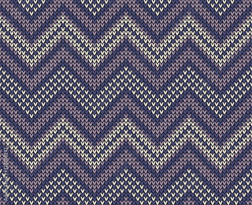Seamless knitted chevron pattern texture in soft purple, pink, and beige for scarf, top, hat, mittens, skirt, or other modern winter textile design. Fabric imitation.