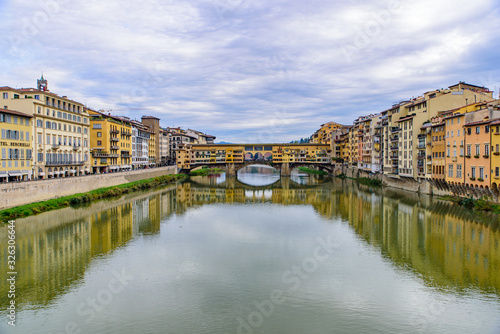 Ponte Vecchio (Old Bridge), a medieval stone bridge with shops on it, Florence, Italy © momo11353