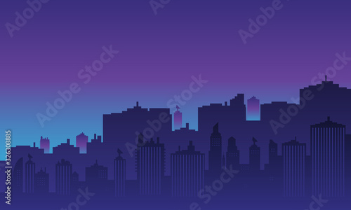 Urban silhouette with tall buildings at night