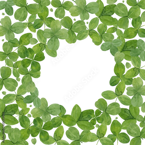 Watercolor hand drawn background with green leaves of clover isolated on white. Frame with copy space  good for st Patrick s day  or summer design etc.