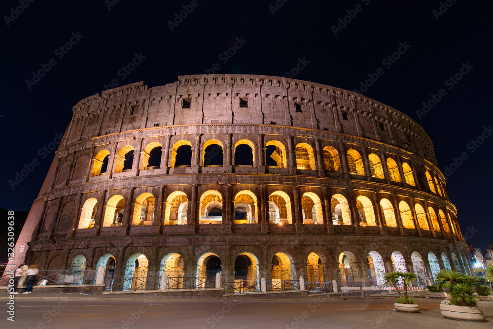 Colosseum at night, an oval amphitheatre and the most popular tourist attraction in Rome, Italy