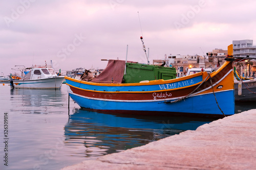 traditional fishing boats of Marsaxlokk  Malta at sunset