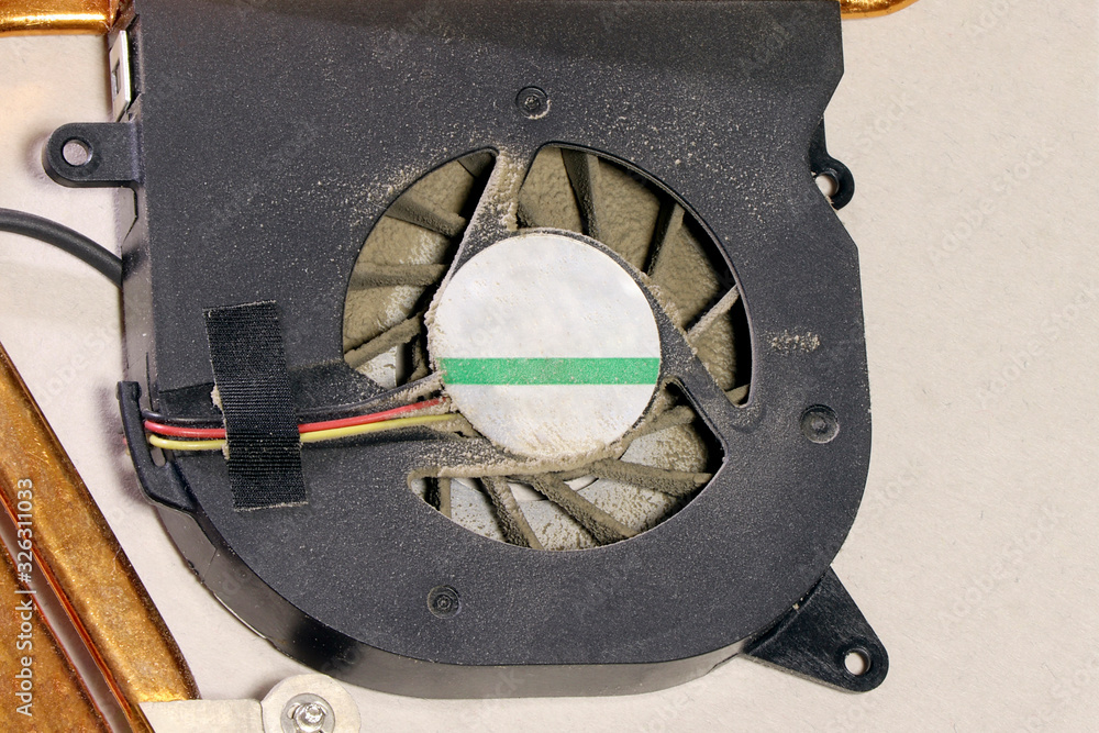 Dust on pc processor cooler. Computer cleaning.Old computer system unit