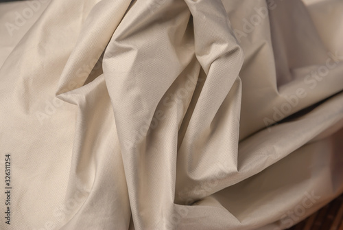 the texture of the draperies,fabrics, material on a horizontal surface, gray color,