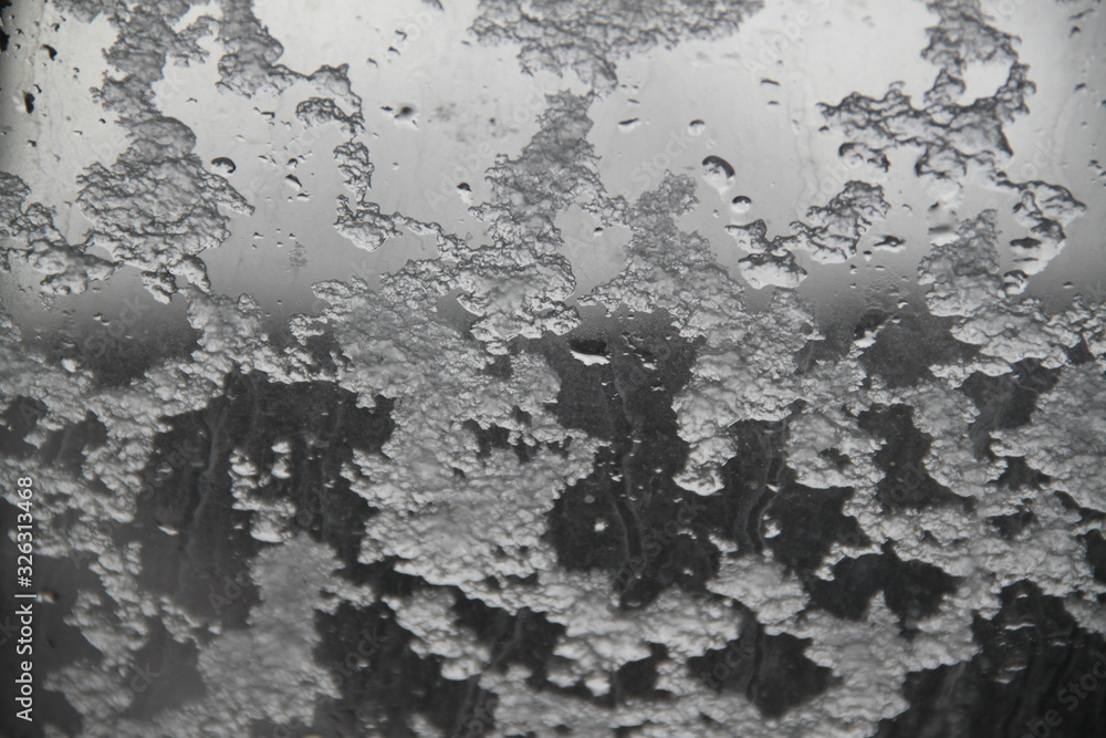 Fototapeta premium Snow flakes on a roof window