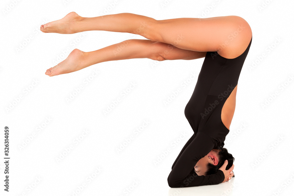Slim woman practicing yoga, isolated on white background