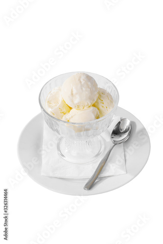 four balls Ice cream dessert, vanilla flavor, isolated on a white background in creamer on a plate with a spoon and a napkin, side view for menu