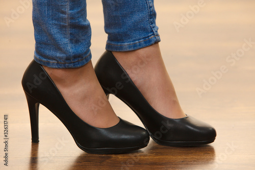 Unrecognizable woman wearing high heels
