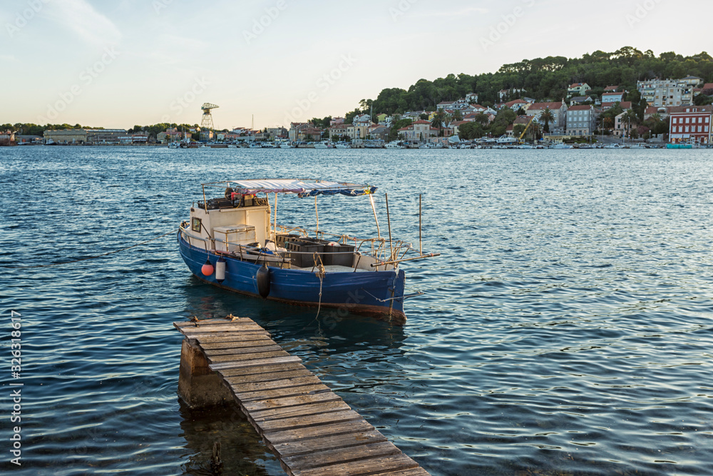 fishing boats moored at the pier in harbour of Mali Losinj town, Croatia. fishing boats moored at the pier in harbour of Mali Losinj town, Croatia.