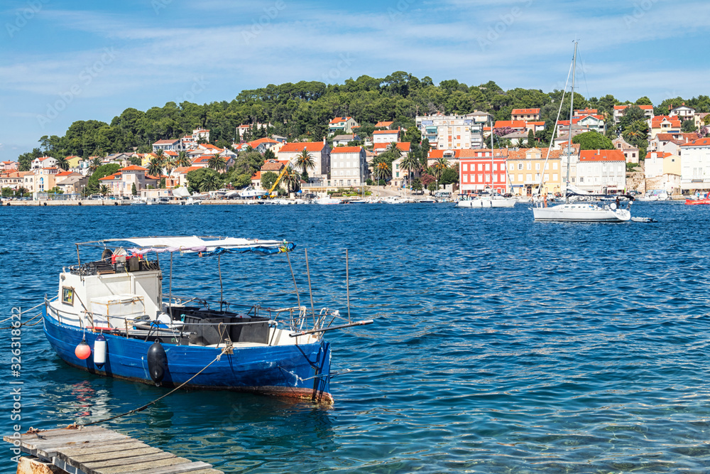 fishing boats moored at the pier in harbour of Mali Losinj town, Croatia.
