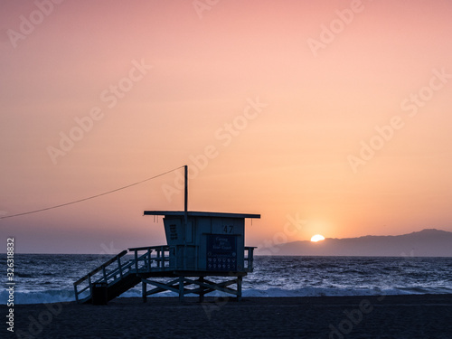Sunset on the beach in California, Coast Guard rescue shed © Lukas