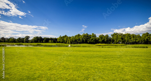 Fototapeta Naklejka Na Ścianę i Meble -  Golf Course (field) with beautiful putting green and scenery in Mezhyhirya Park Kyiv, Ukraine