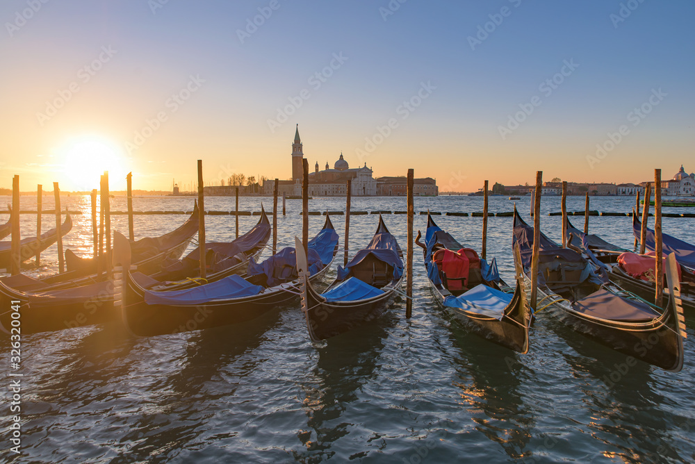 Church of San Giorgio Maggiore with gondolas at sunrise time, Venice, Italy