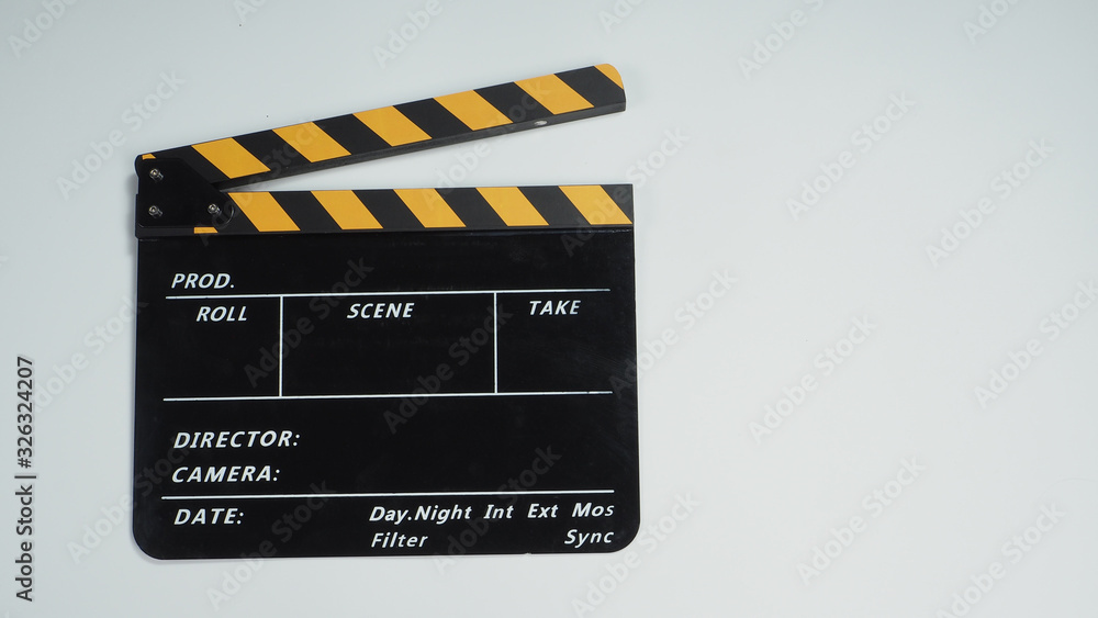Movie slate or clapper board in yellow and black color.It is used in video production and film industry on white background.