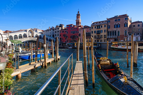View of the Grand Canal, Rialto Bridge, and gondolas from outdoor restaurant seats, Venice, Italy