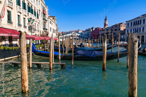 View of the Grand Canal, Rialto Bridge, and gondolas from outdoor restaurant seats, Venice, Italy