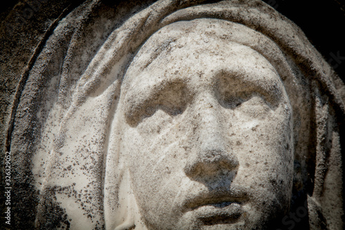 Close up ancient statue of Virgin Mary.