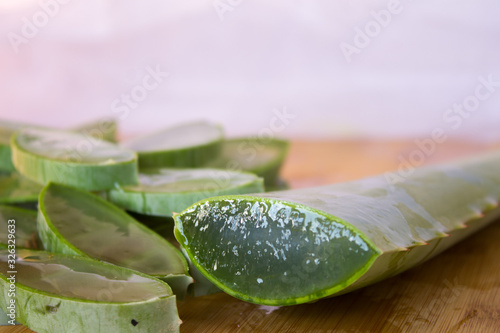 Aloe Vera plants on top of a wooden table