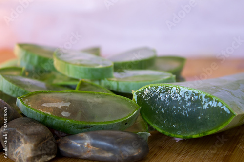 Aloe Vera adorned with stones on a table