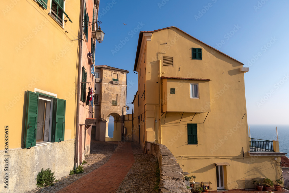 Colourful old-fashioned façade the houses in Imperia old town - the city in Liguria region of Italy