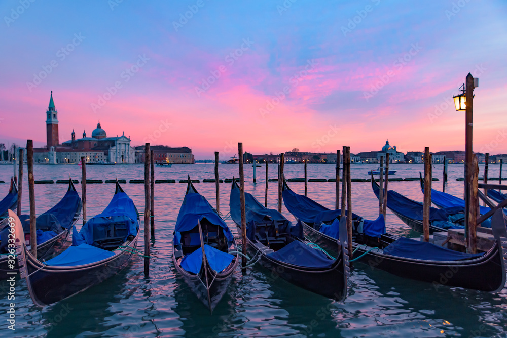 Church of San Giorgio Maggiore with gondolas at sunset time, Venice, Italy