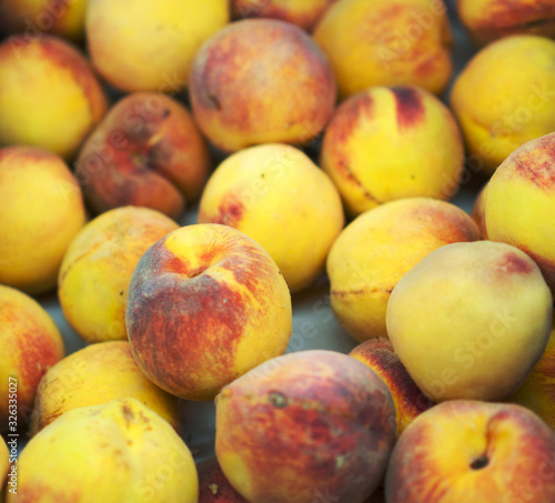 Close-up view of organic peaches in supermarket.