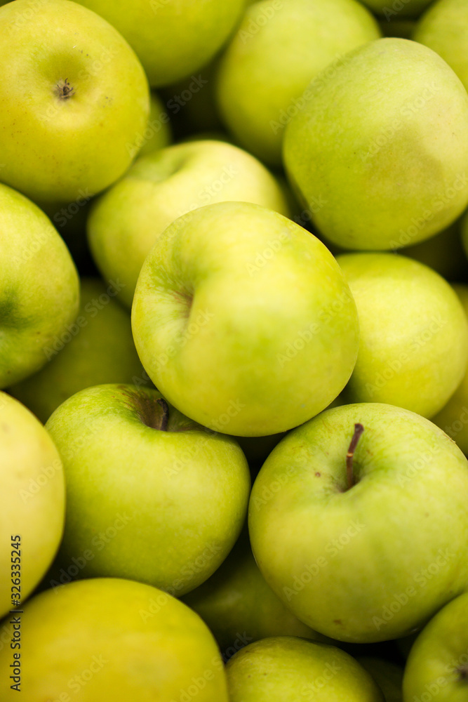 Close-up view of organic green apples in supermarket. Close-up view of organic green apples in supermarket.
