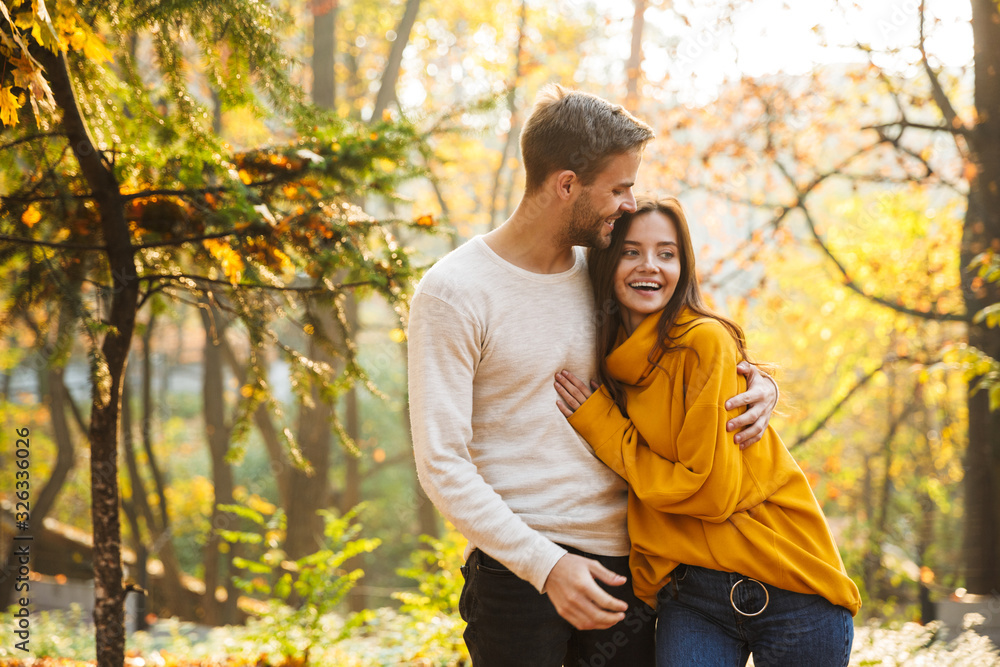 Beautiful young happy couple in love embracing Beautiful young happy couple in love embracing