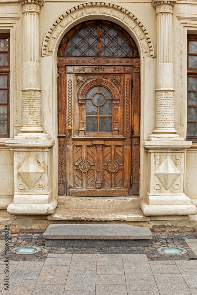 Old wooden authentic door on Rynok Square, Lviv city. Old authentic door of Lviv city.