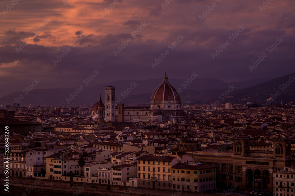 An intense red and purple sunset over florence