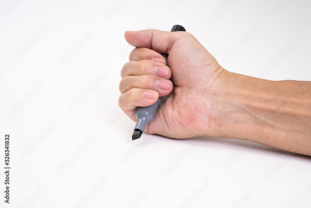 Man hand holding black magic marker pen writing on white background Man hand holding black magic marker pen writing on white background