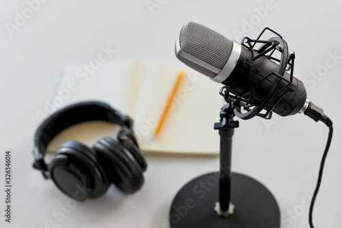 Photography technology, sound recording and podcast concept - headphones , microphone and no