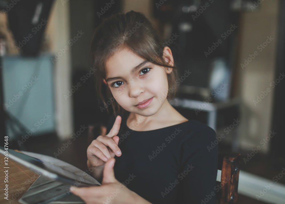 girl playing on a tablet girl playing on a tablet