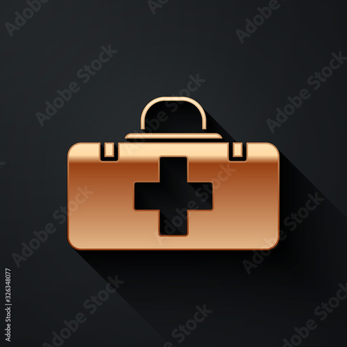 Gold First aid kit icon isolated on black background. Medical box with cross. Medical equipment for emergency. Healthcare concept. Long shadow style. Vector Illustration