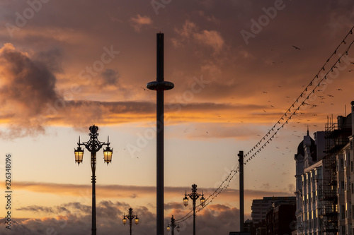 i360 in Brighton at sunset with seagulls photo