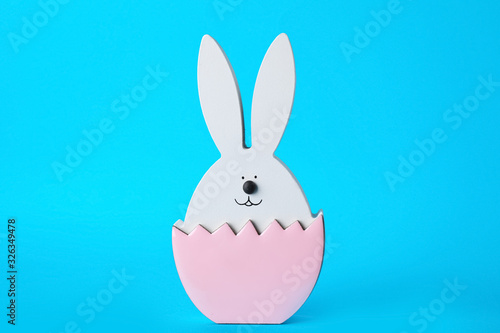 Bunny figure as Easter decor on blue background