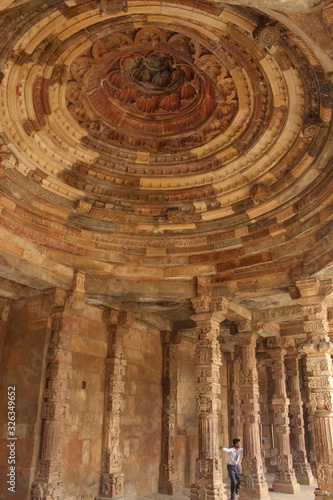 30 October 2019, Delhi, India. Mosque dome and hand carved columns in mughal temple, Qutub Minar