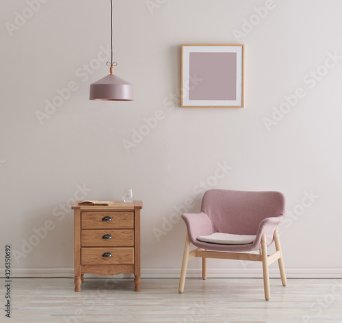Pink wall  chair and frame decoration with red coffee table style.