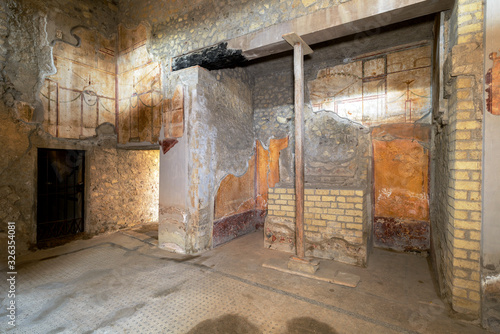 Oplontis Villa of Poppea - In a niche  is the lararium with a large masonry altar  for the worship of the Lari  the domestic gods.  Part of the carbonized beam above the niche is still visible.