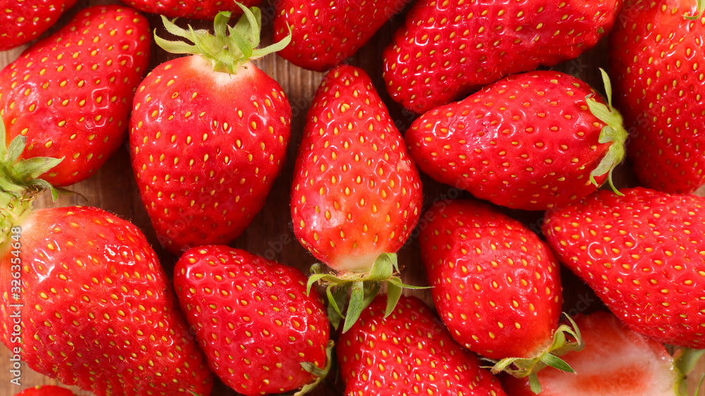 closeup on fresh strawberry, top view closeup on fresh strawberry, top view