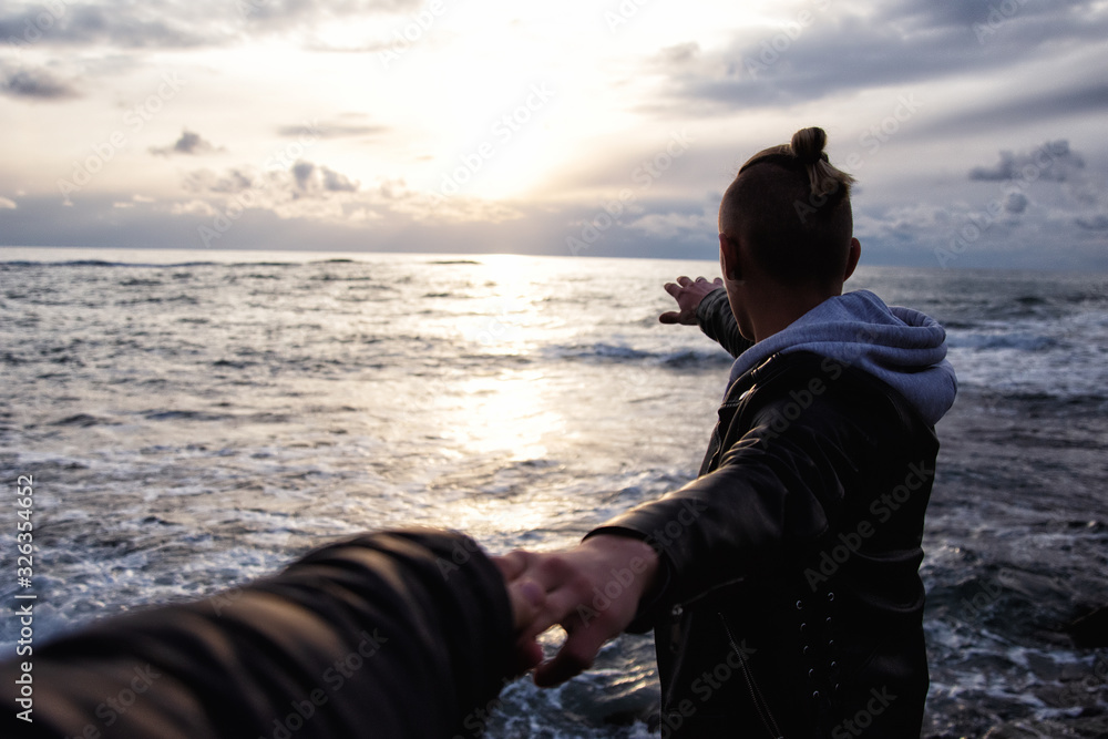 Holidays and vacations. Two guys at the sea. 