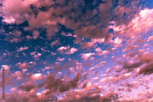 Colorful clouds in the blue sky of Latin America in contrast to the sunlight