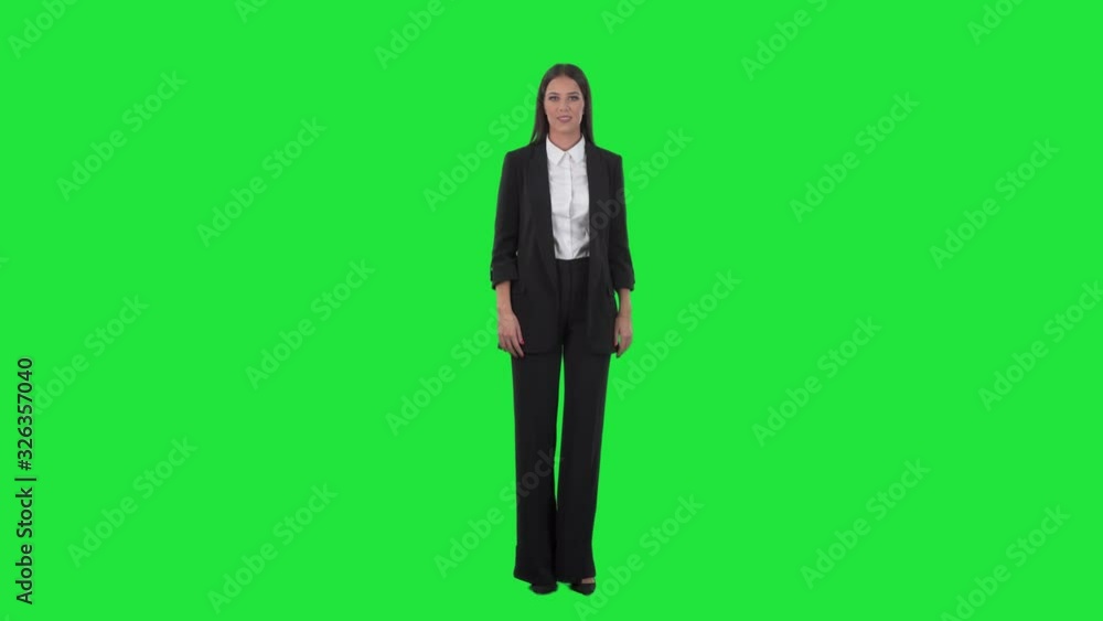 Elegant well dressed business or sales woman showing and advertising to sell a product. Full body on chroma key green screen background. Elegant well dressed business or sales woman showing and advertising to sell a product. Full body on chroma key green screen background.
