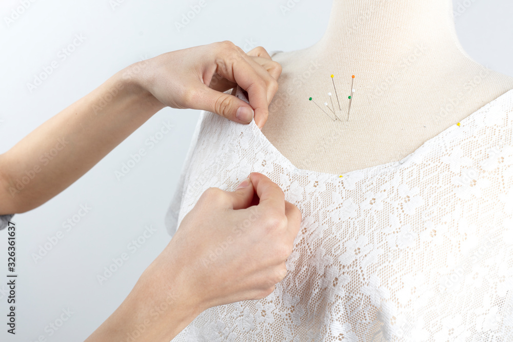 fashion designer working with tailor's dummy