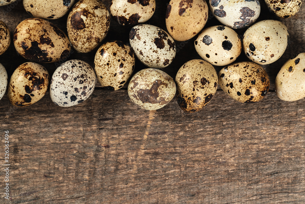 Quail eggs on a wooden table